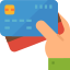 A hand holding 3 cards that represents the Integration Of Multiple Payment Methods with GroupRM
