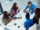 A group of people collaborating around a table with laptops, focused on improving group booking revenue through pricing insights.