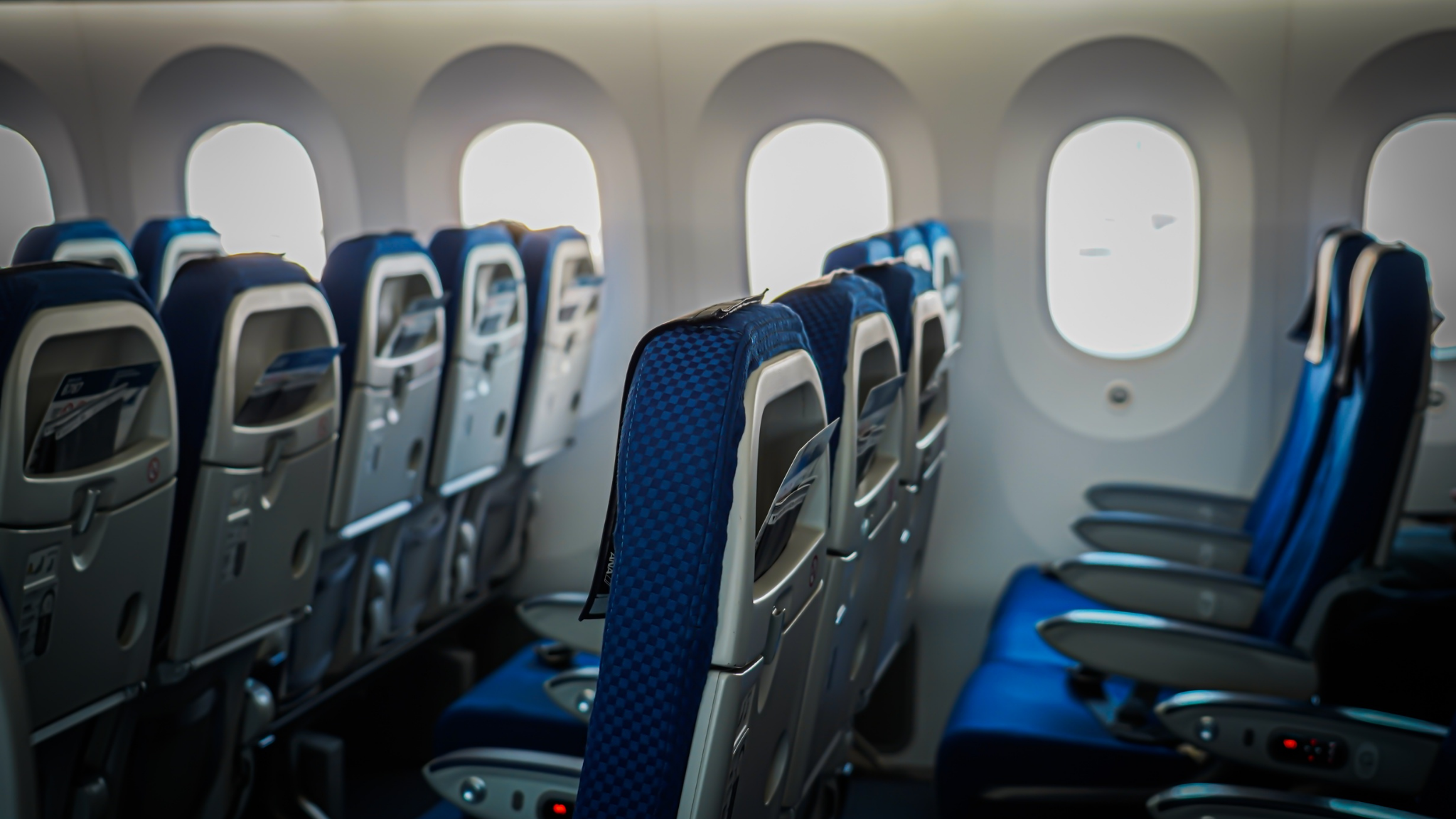 Airline economy cabin seats highlighting seat selection and ancillary services for retail travelers