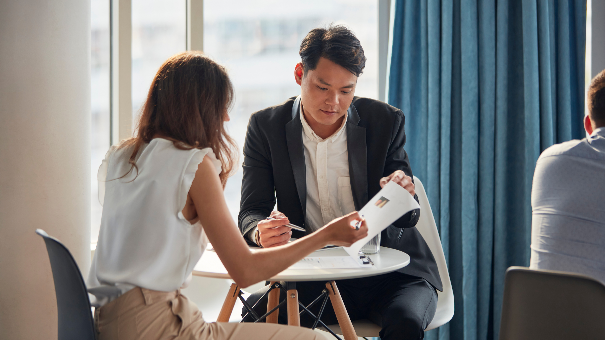 Airline sales professionals reviewing ancillary opportunities in group booking strategy