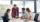 A gathering of individuals around a table, featuring a man and woman actively participating in the discussion about Top 5 Ways AI-Driven Dynamic Pricing Will Transform Group Sales in 2026