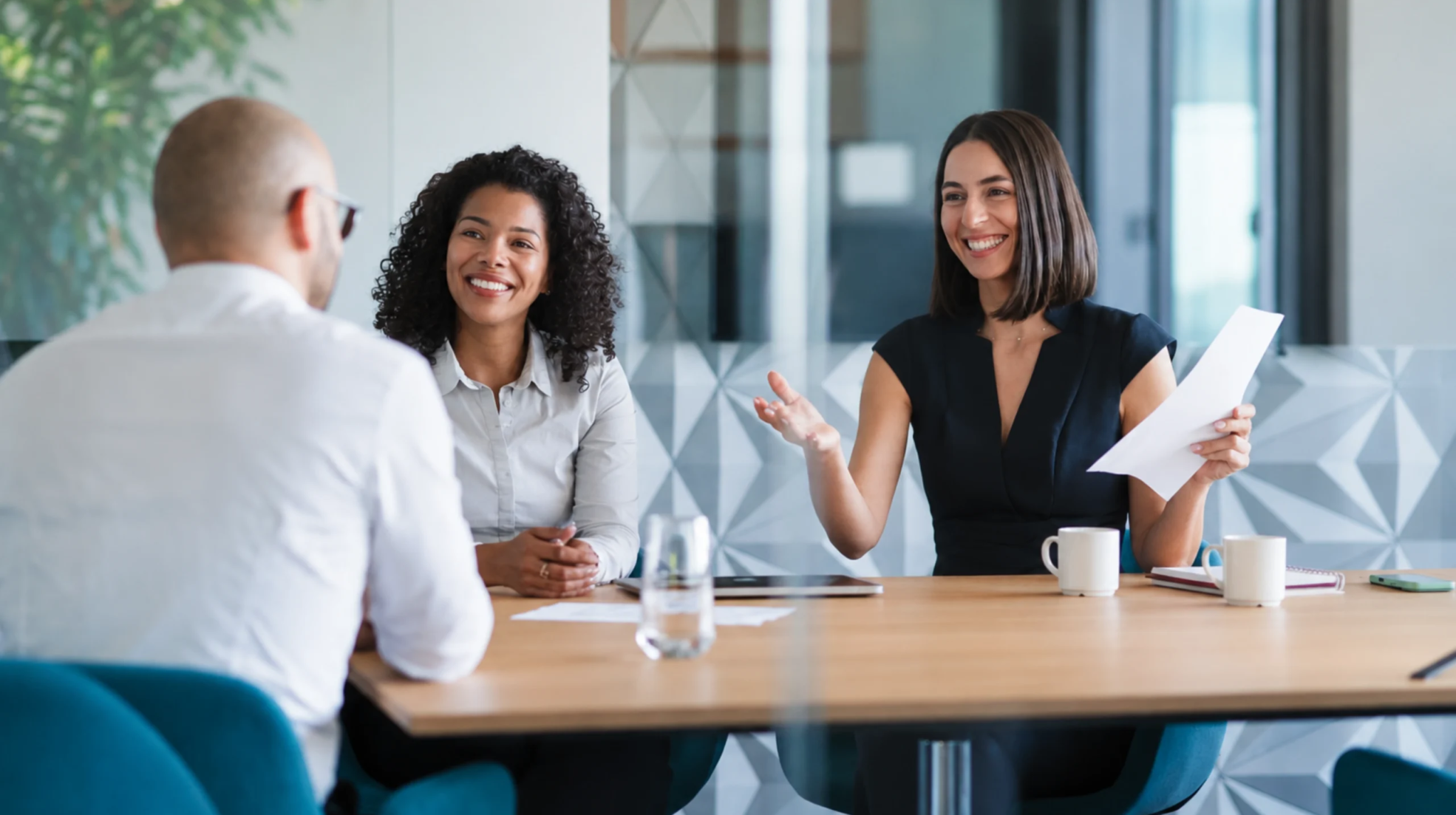 Airline group sales team discussing ancillary revenue opportunities, including seats, baggage, and meals, during the initial booking quotation.